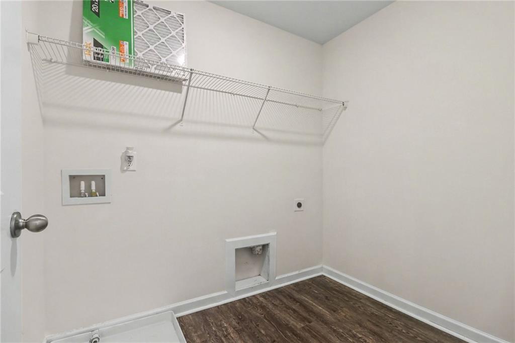 4635 Bluffton Court Cumming, GA 30028 - Photo 19 of 27 a view of a room with racks on the wall