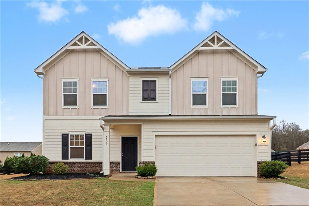 4635 Bluffton Court Cumming, GA 30028 - Photo 2 of 27 a view of a house with a yard