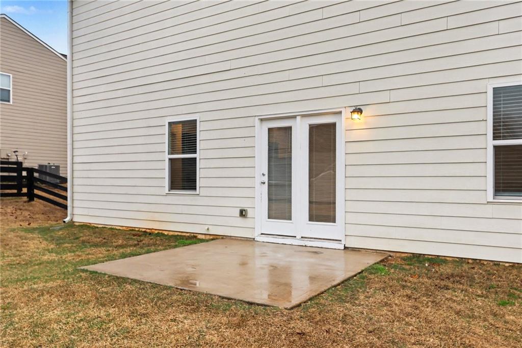 4635 Bluffton Court Cumming, GA 30028 - Photo 25 of 27 a view of a backyard with a balcony