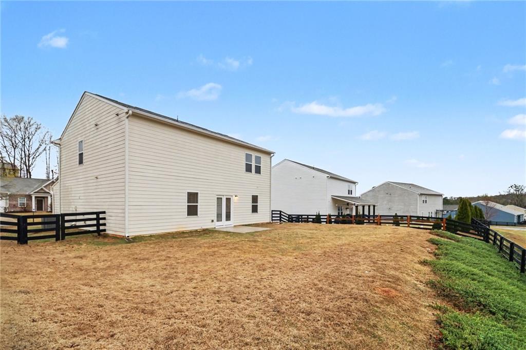 4635 Bluffton Court Cumming, GA 30028 - Photo 27 of 27 a view of a house with a backyard