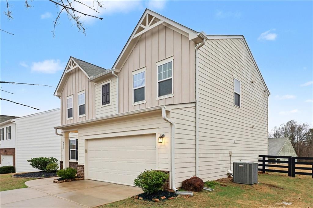 4635 Bluffton Court Cumming, GA 30028 - Photo 3 of 27 a view of a house with a yard