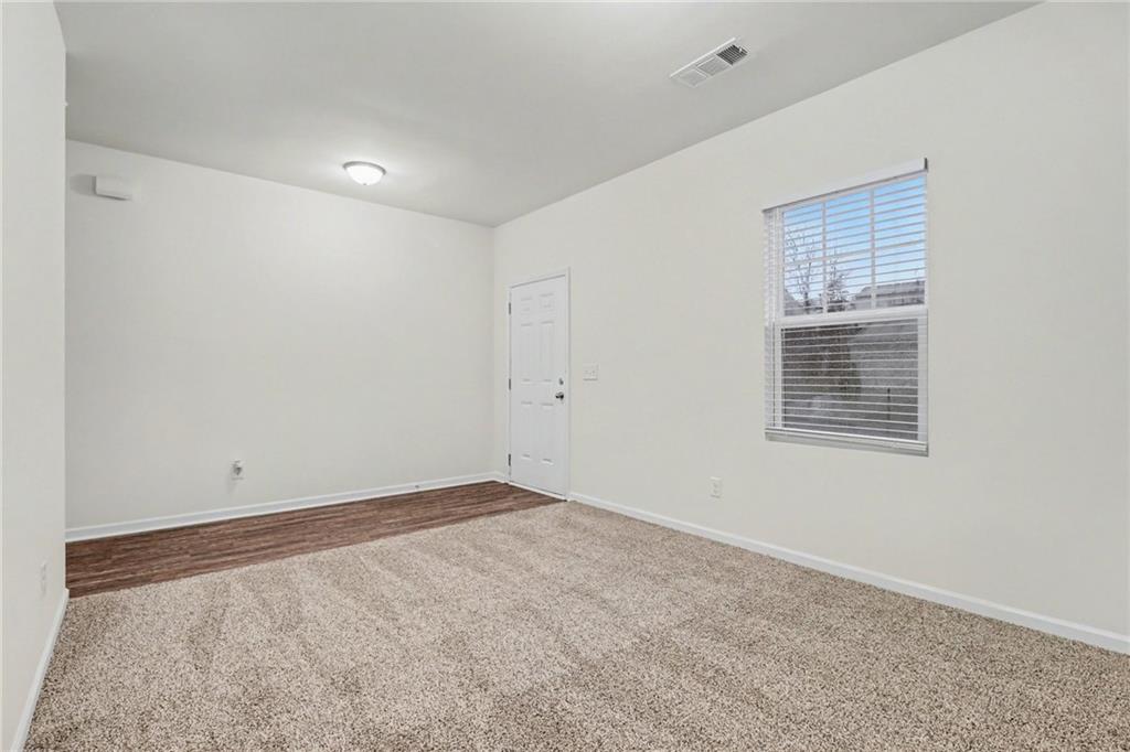 4635 Bluffton Court Cumming, GA 30028 - Photo 9 of 27 a view of an empty room with a window