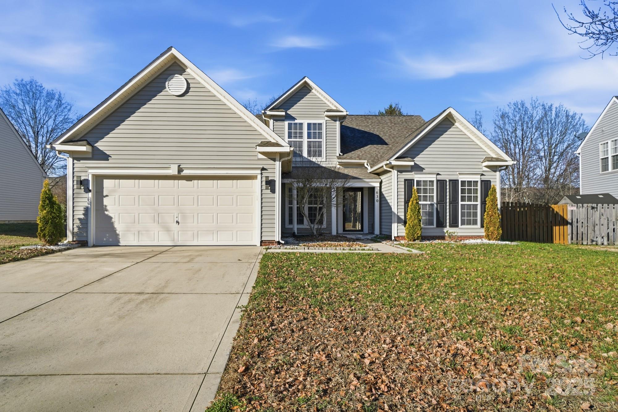 front view of a house with a garden
