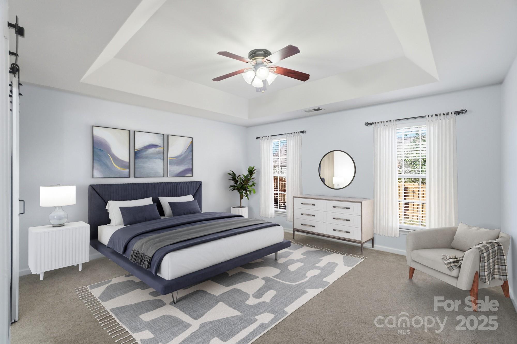 630 Springhouse Place Clover, SC 29710 - Photo 15 of 32 a bedroom with a bed and a large window with the potted plants
