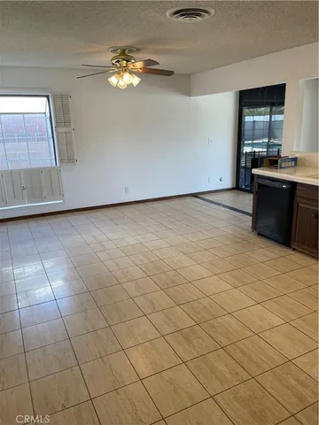 a view of a kitchen with microwave and cabinets