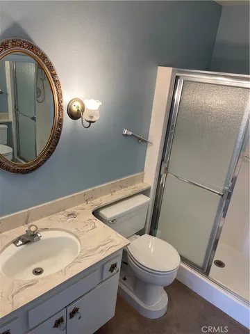 a bathroom with a glass shower door