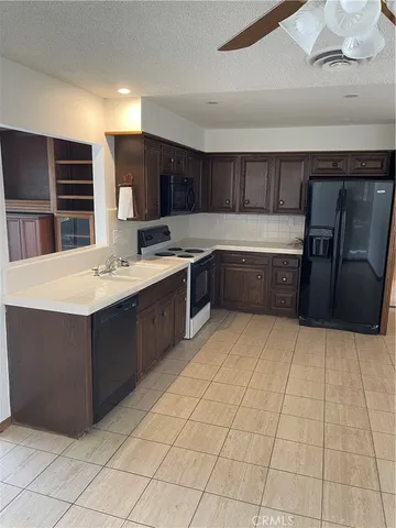 a view of a room that has a door and a window