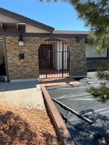 a view of backyard with wooden fence