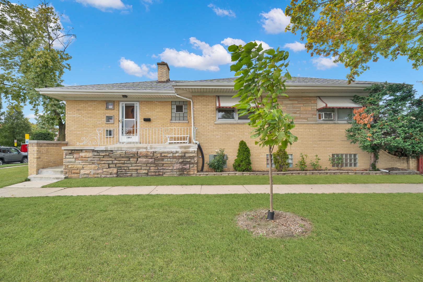 a front view of a house with a yard