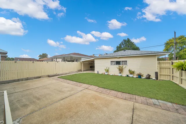 a view of a backyard of the house