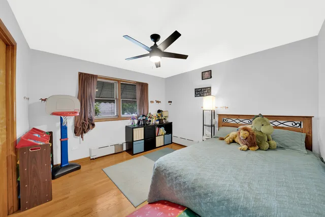 a bed room with a bed and a chandelier