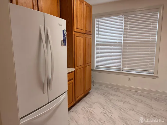 a kitchen with granite countertop cabinets stainless steel appliances and sink