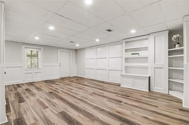 a view of a room with wooden floor and closet