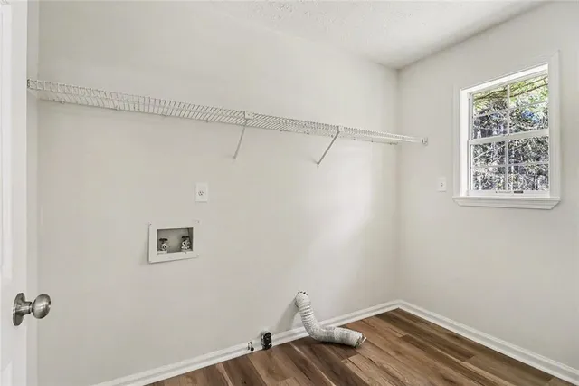 a view of balcony with wooden floor