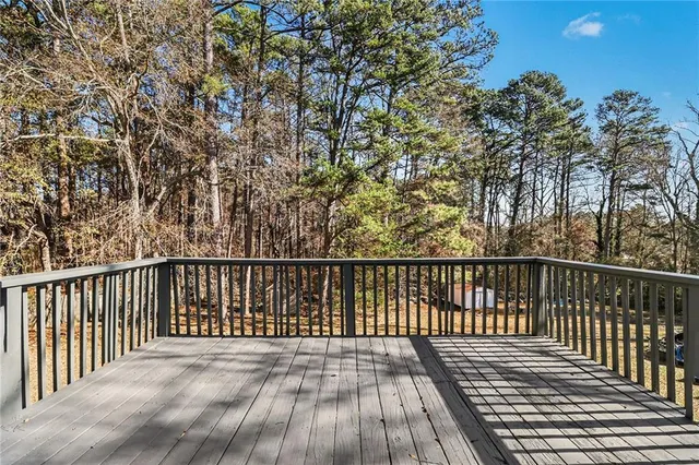 a view of balcony with wooden floor
