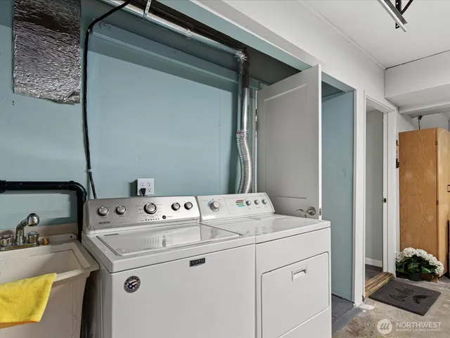 a utility room with dryer and washer