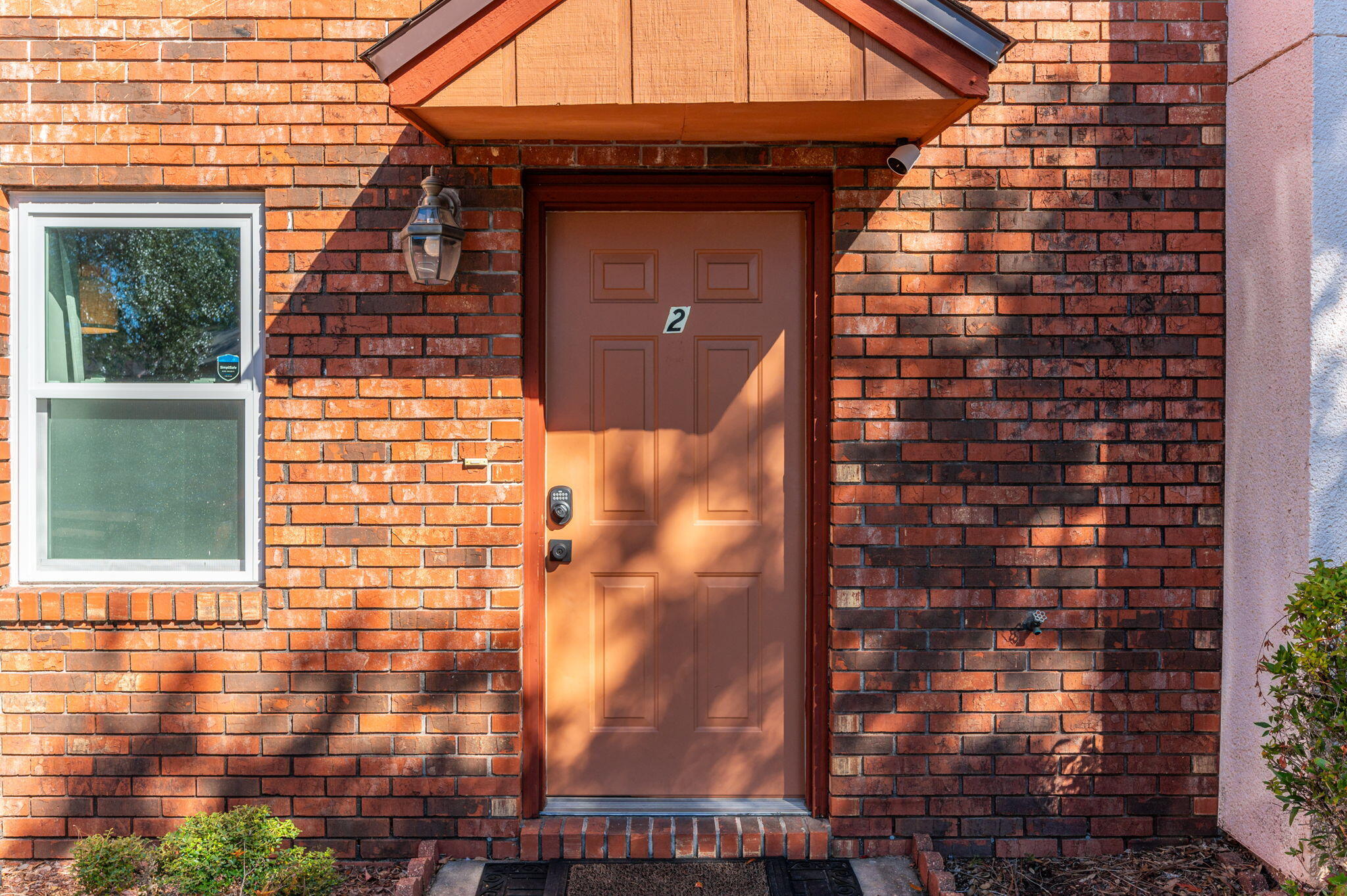 a view of building with glass door