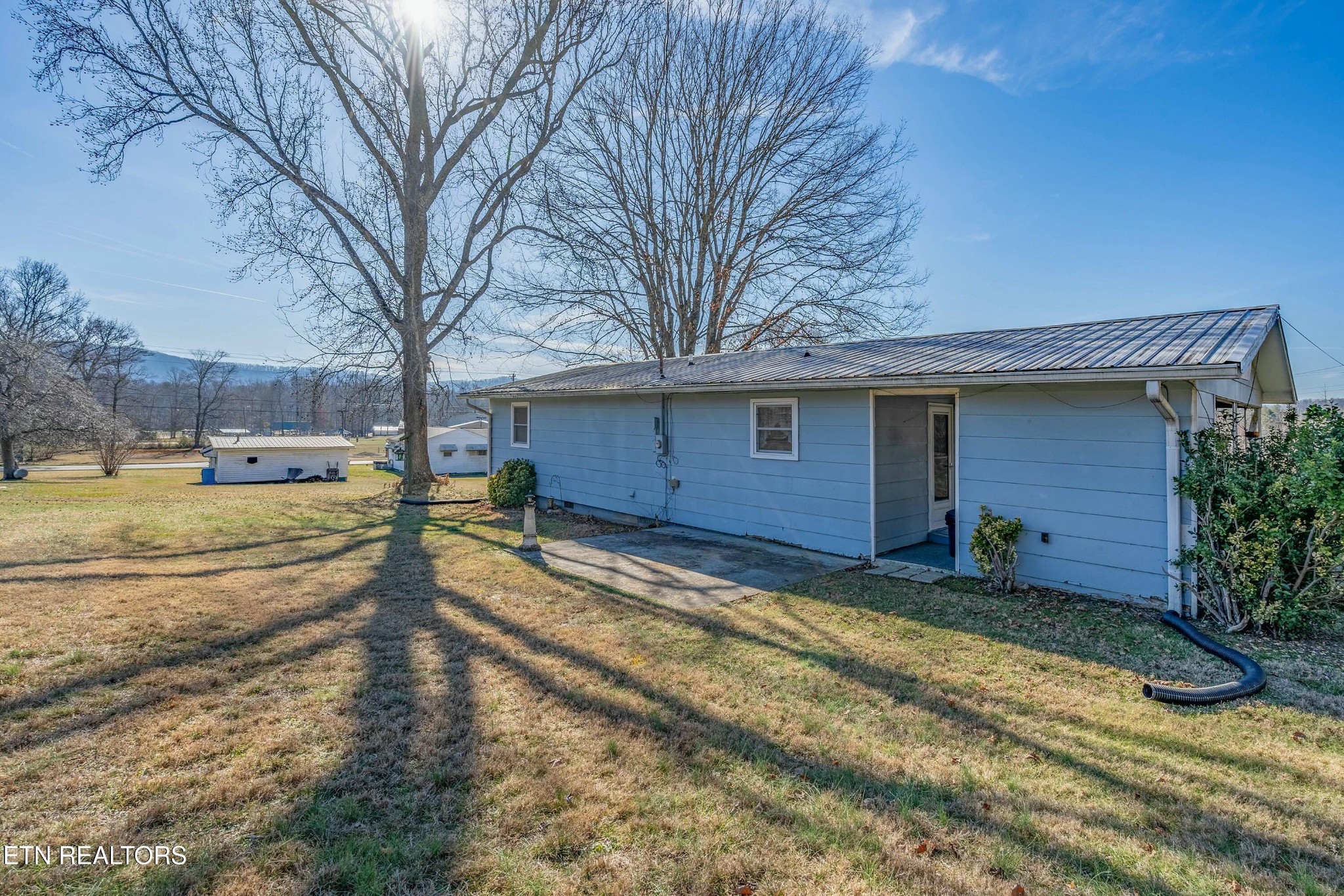 1747 Fairview Road Oliver Springs, TN 37840 - Photo 16 of 20 a view of a house with a yard covered in snow