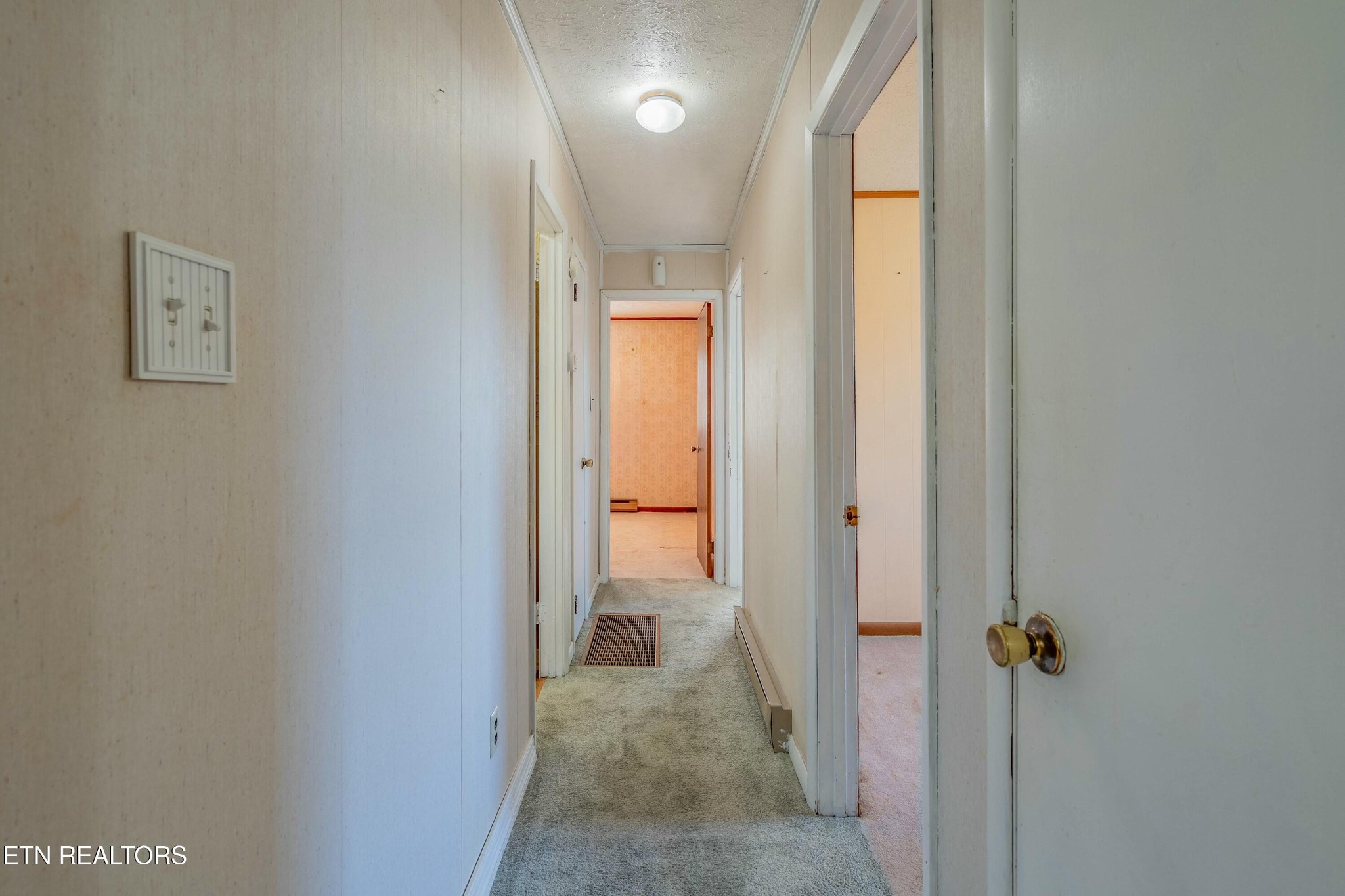 1747 Fairview Road Oliver Springs, TN 37840 - Photo 6 of 20 a view of a hallway with wooden floor and a bathroom