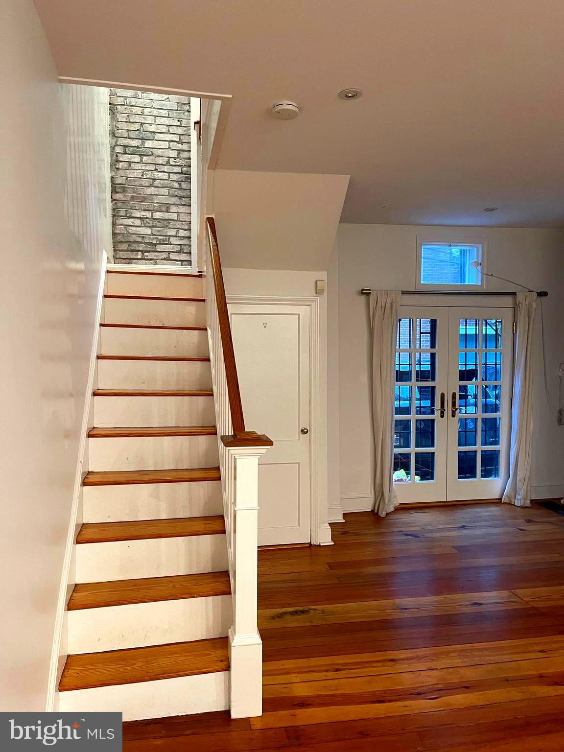 1835 Addison Street Philadelphia, PA 19146 - Photo 17 of 32 Stairway to 2nd floor showing back brick wall