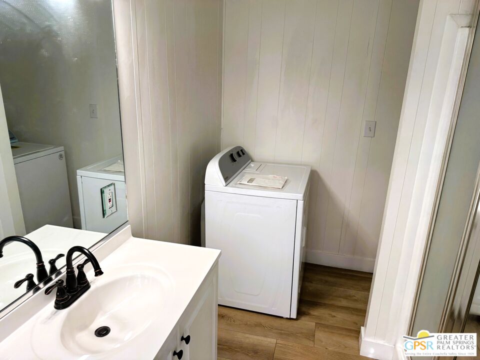 17850 Corkill Road, Unit 94 Desert Hot Springs, CA 92241 - Photo 24 of 39 a bathroom with a sink and a washer dryer