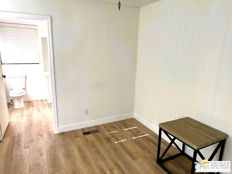 17850 Corkill Road, Unit 94 Desert Hot Springs, CA 92241 - Photo 28 of 39 a view of a room with wooden floor and a rug