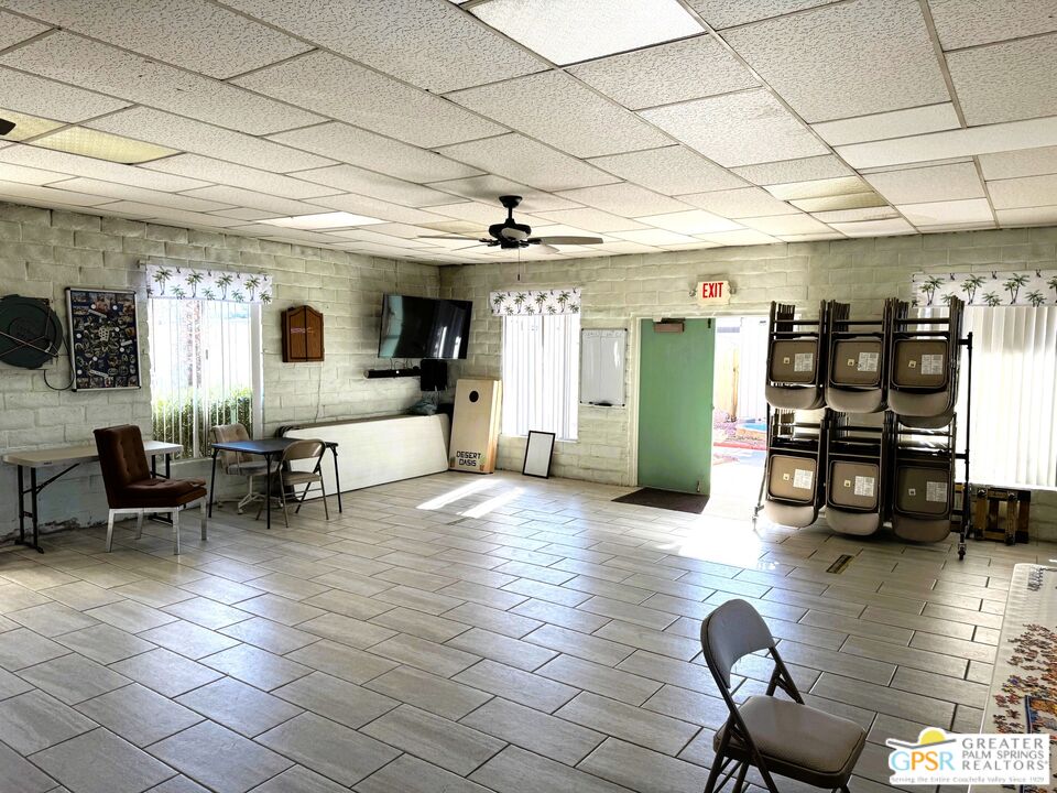 17850 Corkill Road, Unit 94 Desert Hot Springs, CA 92241 - Photo 37 of 39 a living room with furniture and a flat screen tv