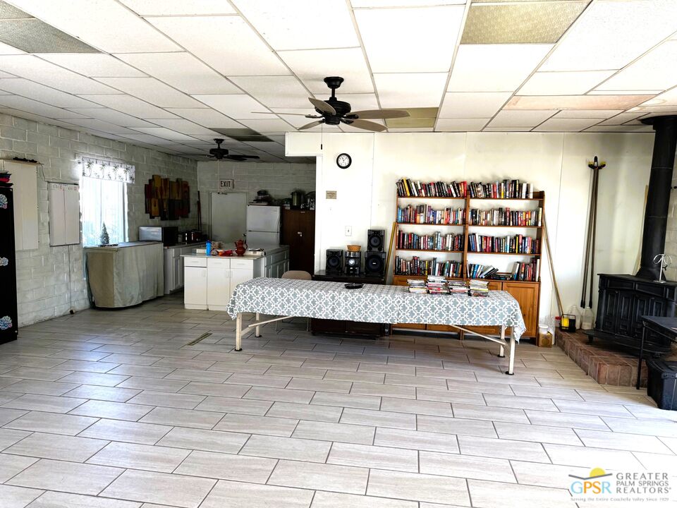 17850 Corkill Road, Unit 94 Desert Hot Springs, CA 92241 - Photo 38 of 39 a living room with furniture and a flat screen tv