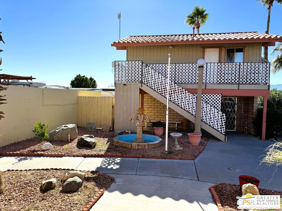 17850 Corkill Road, Unit 94 Desert Hot Springs, CA 92241 - Photo 39 of 39 a front view of a house with entryway