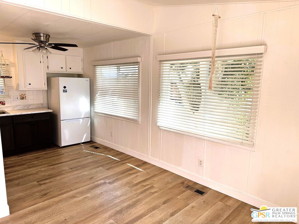 17850 Corkill Road, Unit 94 Desert Hot Springs, CA 92241 - Photo 8 of 39 a view of a kitchen with an empty space and a window