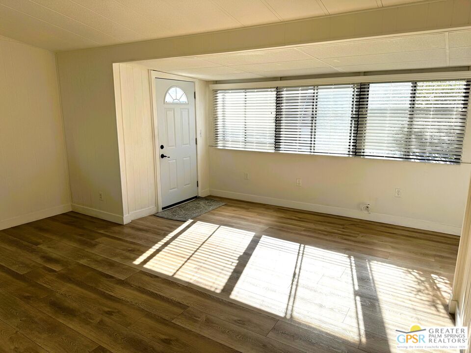 17850 Corkill Road, Unit 94 Desert Hot Springs, CA 92241 - Photo 9 of 39 a view of an empty room and window
