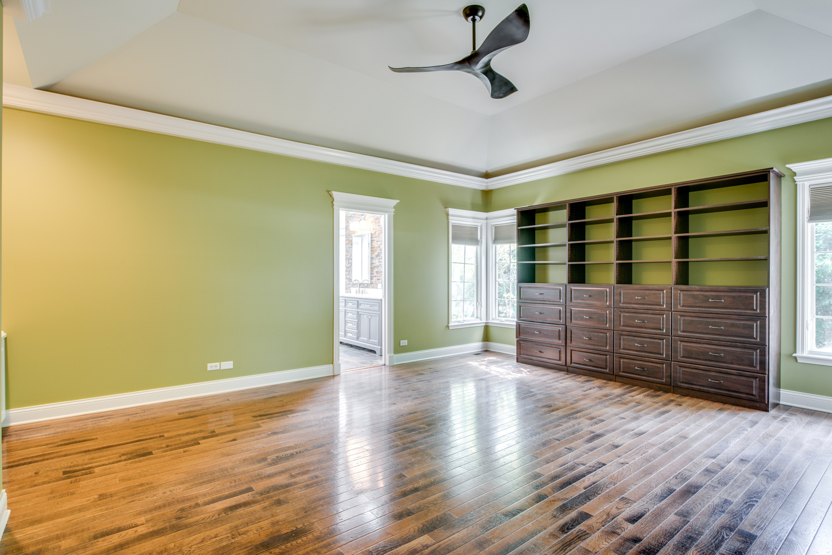 1736 Robert Lane Naperville, IL 60564 - Photo 26 of 69 a view of an empty room with wooden floor and a window