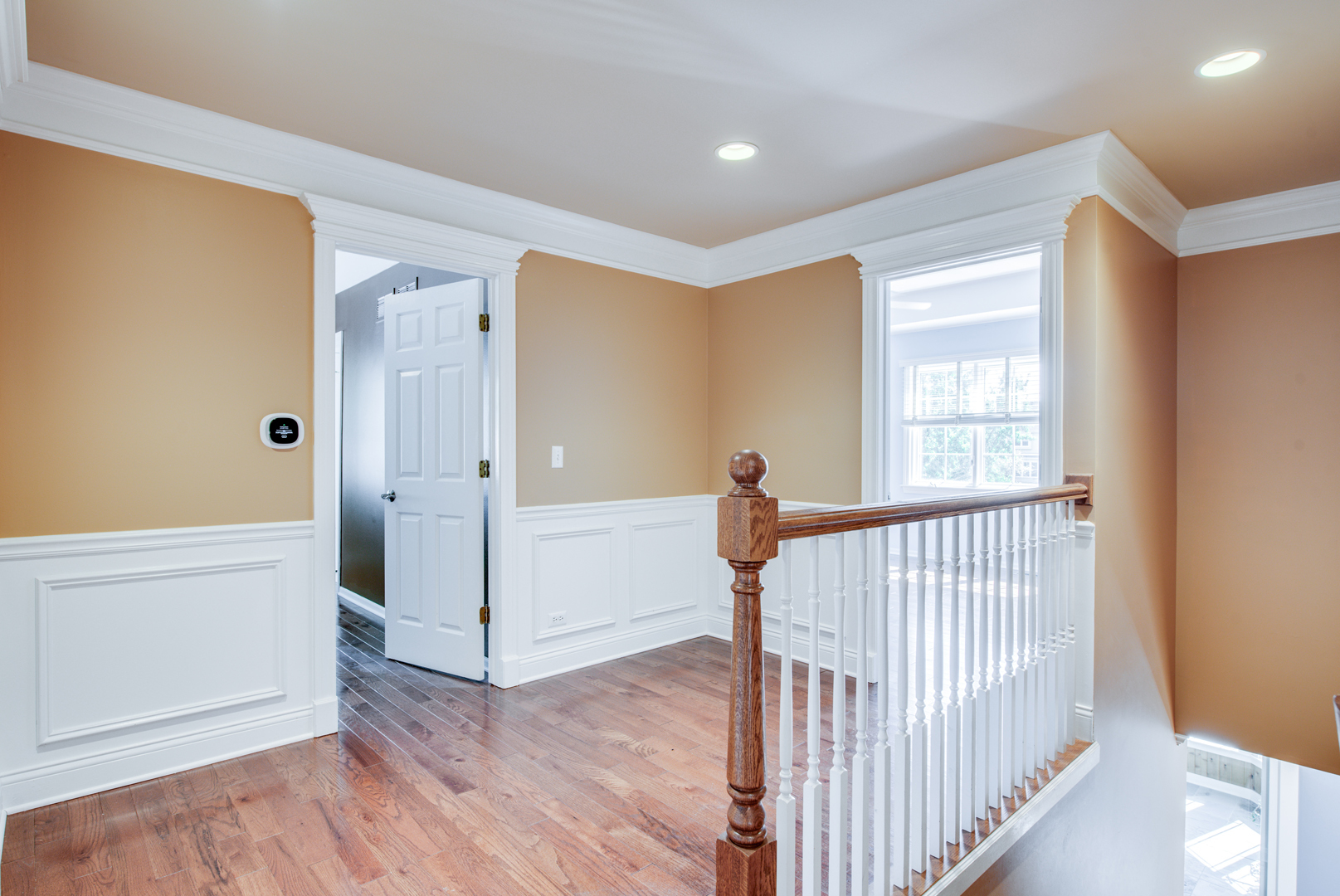 1736 Robert Lane Naperville, IL 60564 - Photo 33 of 69 a view of a hallway with wooden floor and windows