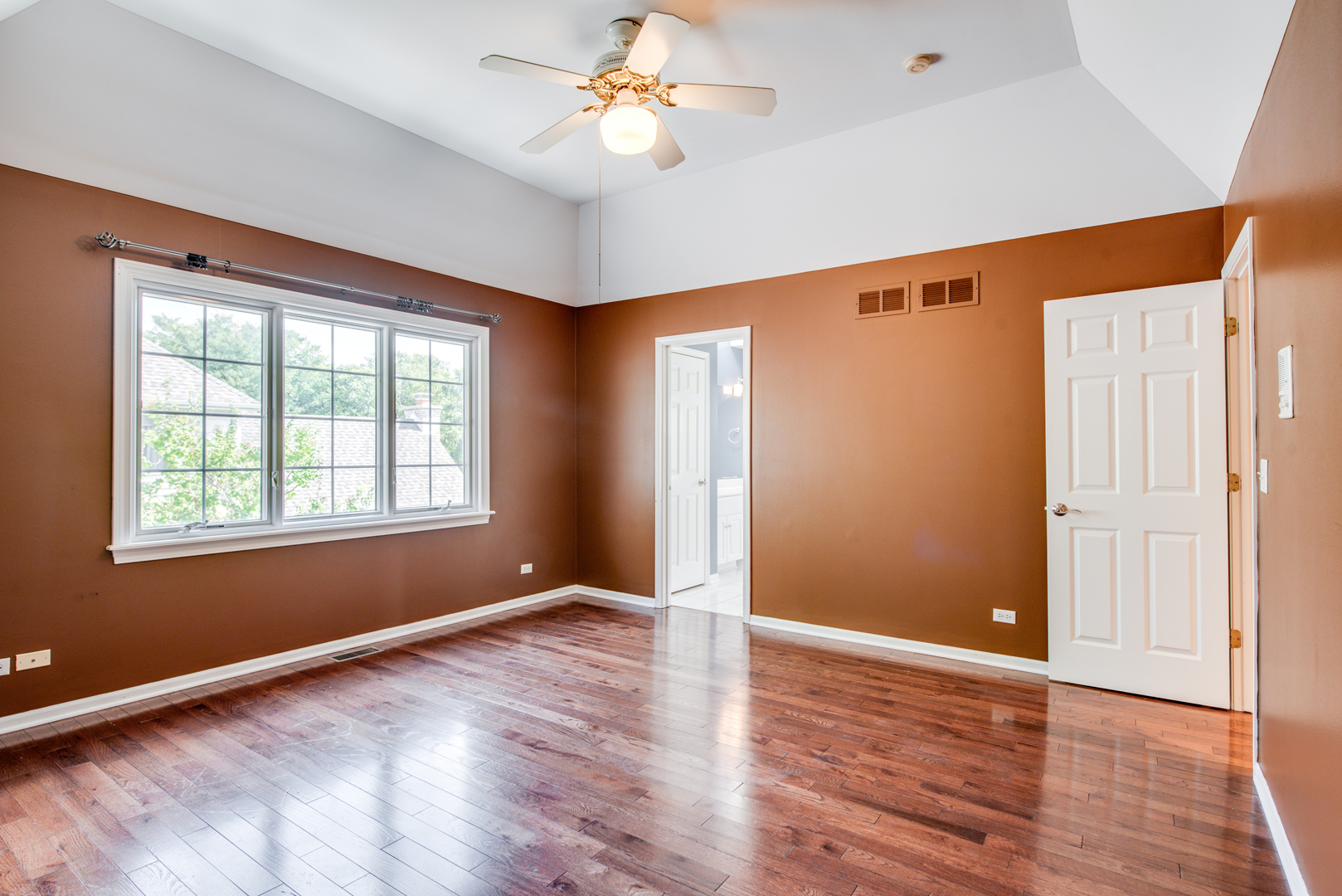 1736 Robert Lane Naperville, IL 60564 - Photo 37 of 69 an empty room with wooden floor chandelier fan and windows