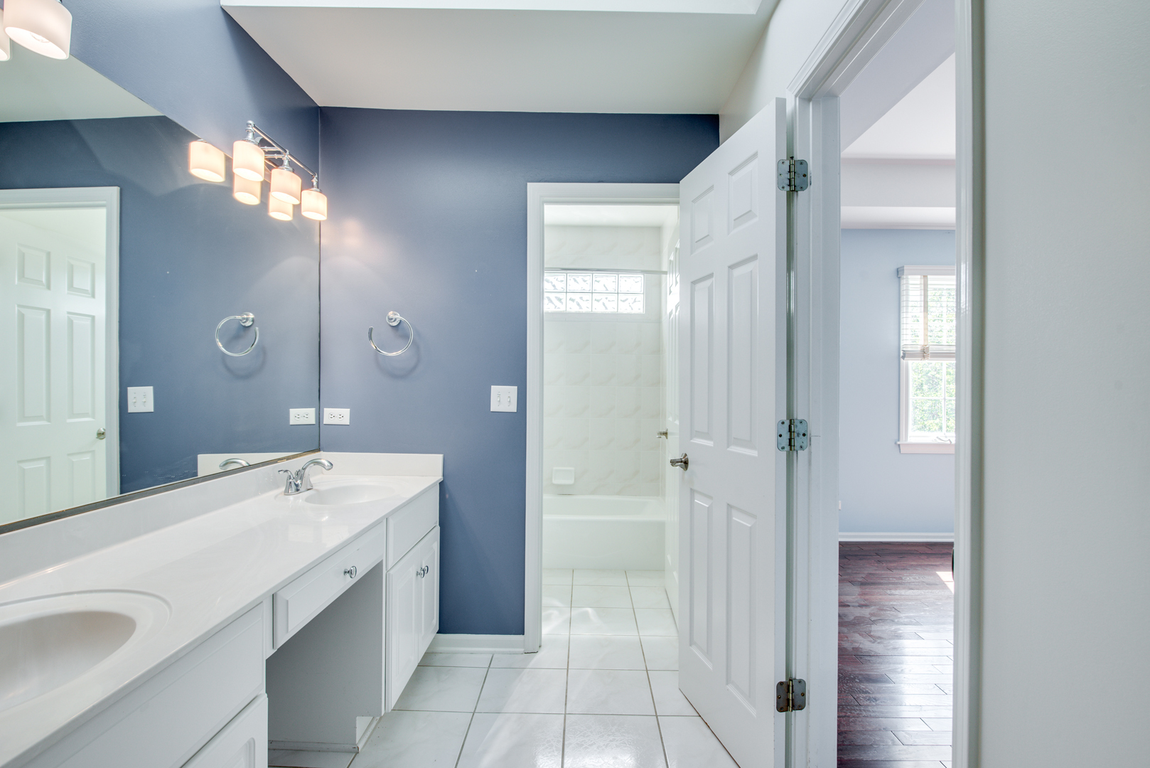 1736 Robert Lane Naperville, IL 60564 - Photo 40 of 69 a spacious bathroom with a bathtub shower sink vanity and mirror