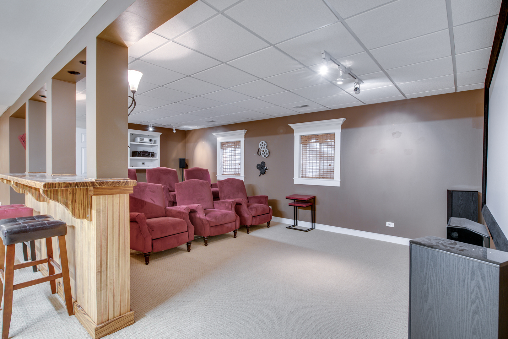 1736 Robert Lane Naperville, IL 60564 - Photo 45 of 69 a living room with furniture a flat screen tv and gym equipment