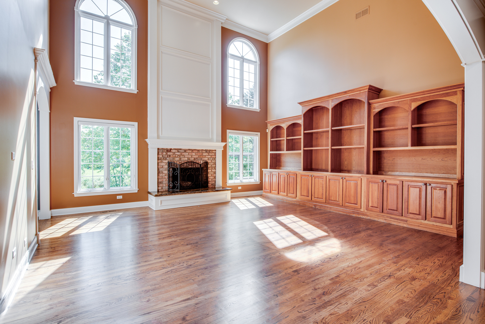 1736 Robert Lane Naperville, IL 60564 - Photo 9 of 69 a view of empty room with wooden floor and fireplace