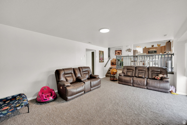1284 North 900 West Clinton, UT 84015 - Photo 13 of 22 Living area with carpet floors and stairs