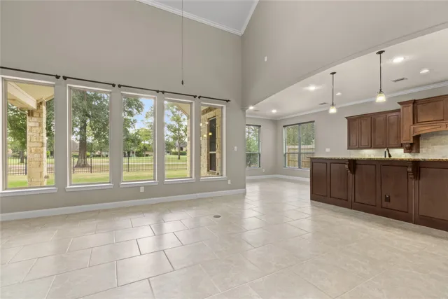 a kitchen with stainless steel appliances a sink and a stove top oven