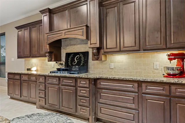 a spacious bedroom with a bed and ceiling fan