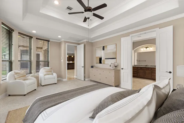 a spacious bathroom with a tub sink and mirror