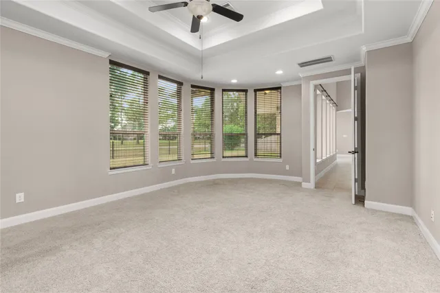 a spacious bathroom with a double vanity sink mirror and bathtub