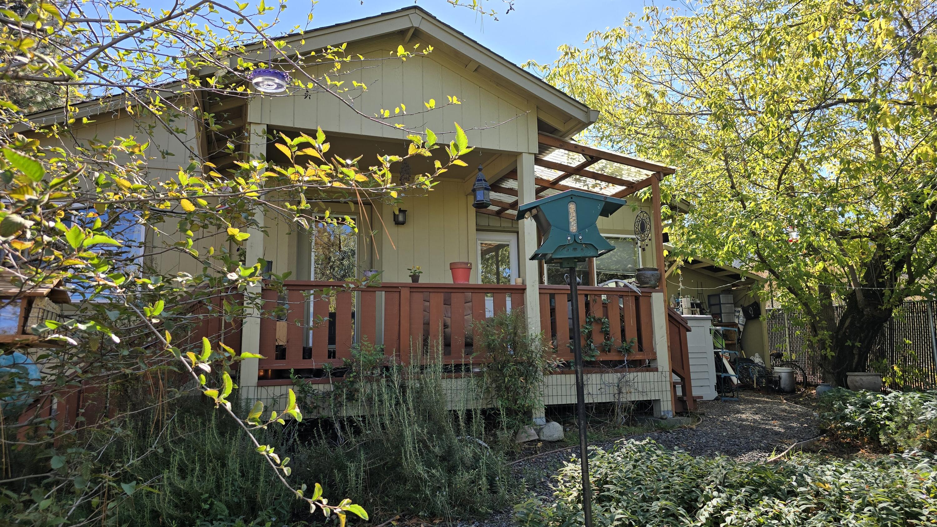488 Crowson Road Ashland, OR 97520 - Photo 1 of 30 a view of a house with a tree and a yard