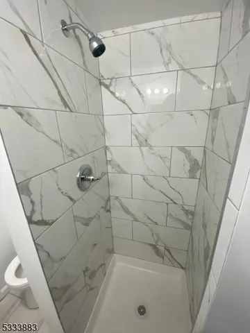 a bathroom with a bathtub and toilet