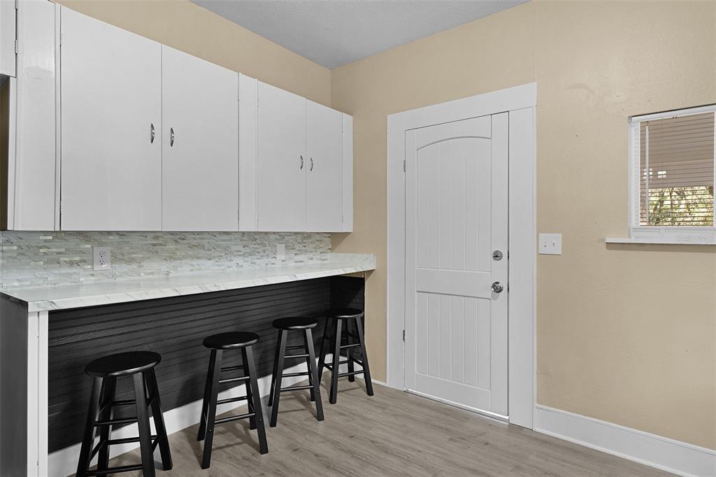 2245 Northwest 63rd Place Ocala, FL 34475 - Photo 15 of 38 a kitchen with a table and chairs