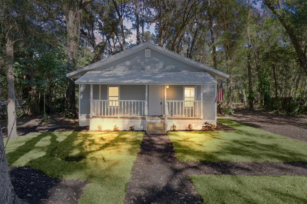 2245 Northwest 63rd Place Ocala, FL 34475 - Photo 2 of 38 a view of a house with backyard and sitting area