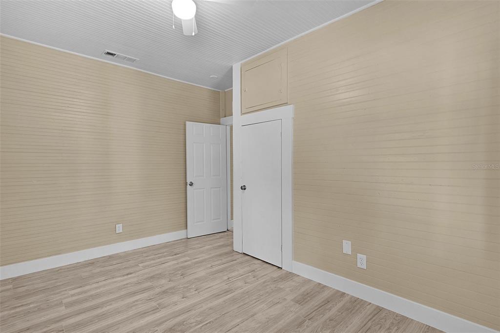 2245 Northwest 63rd Place Ocala, FL 34475 - Photo 21 of 38 a view of an empty room with wooden floor