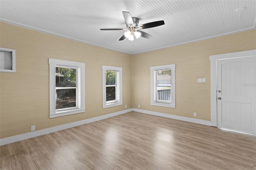 2245 Northwest 63rd Place Ocala, FL 34475 - Photo 24 of 38 a view of an empty room with wooden floor and a window