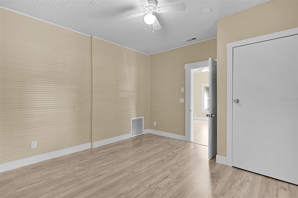 2245 Northwest 63rd Place Ocala, FL 34475 - Photo 25 of 38 wooden floor in an empty room with a bathroom