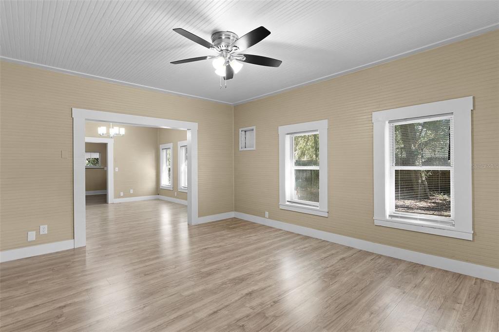 2245 Northwest 63rd Place Ocala, FL 34475 - Photo 26 of 38 a view of an empty room with a window and wooden floor
